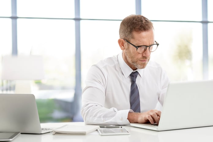 Professional man using laptops