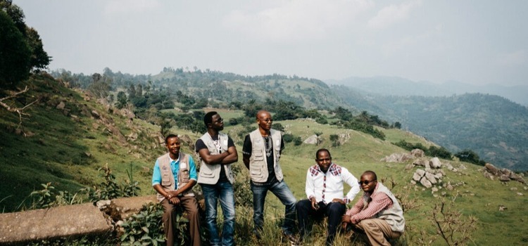 Peace Direct workers on a rural hill