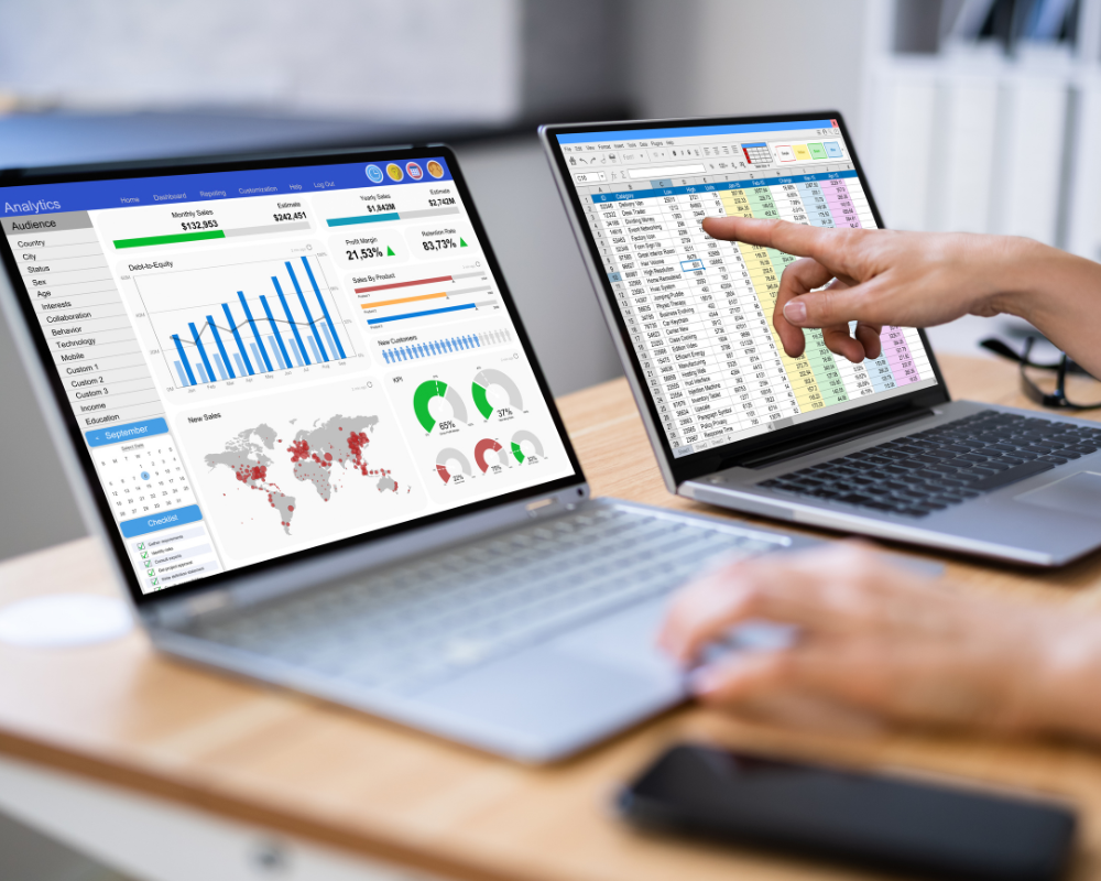 Computer screens showing accurate reporting dashboards produced by a renewable energy accounting reports